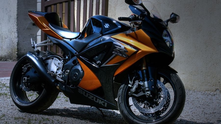 Orange and black Suzuki sports bike, typical of the superbikes we transport from Delhi to Kolkata